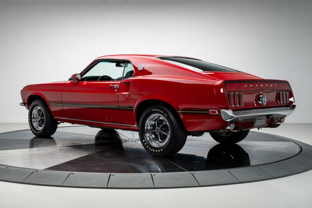 Rear three-quarter view of a ground-up restored 1969 Ford Mustang Mach 1 R-code 428 Cobra Jet SportsRoof, sold by RK Motors